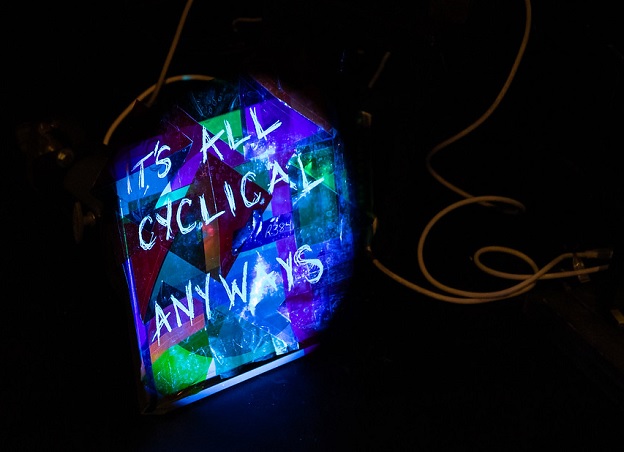 back-lit mosaic that reads "it's all cyclical anyways"