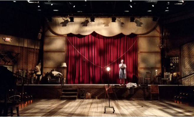 women standing on a stage